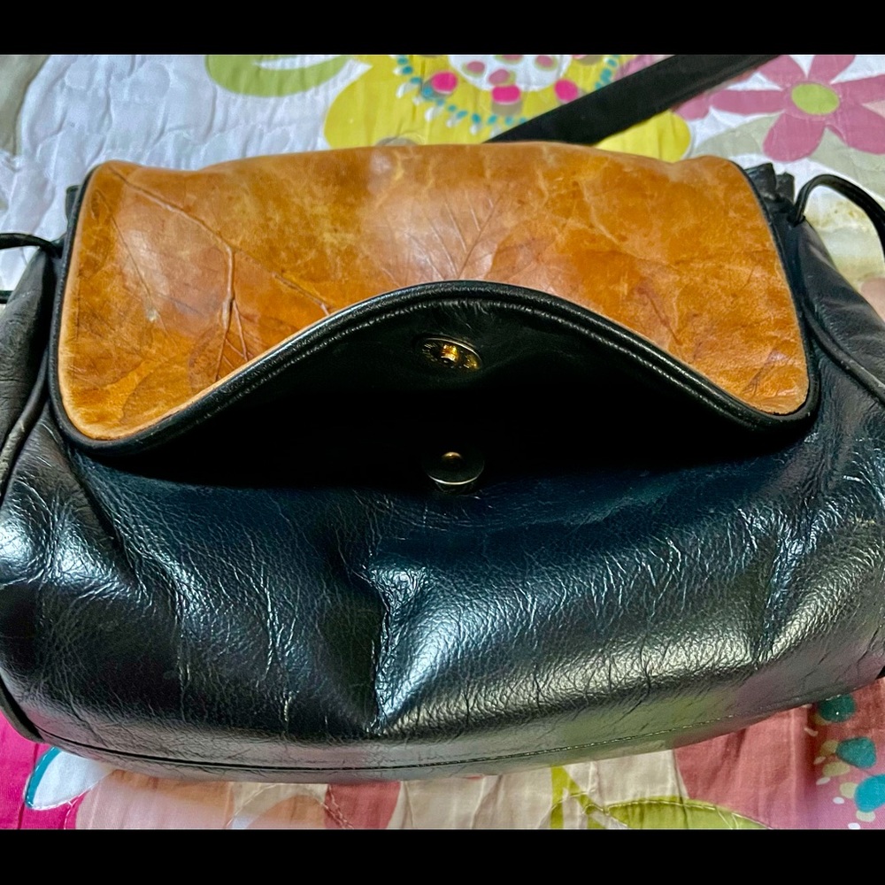 A black and brown purse, inspired by nature